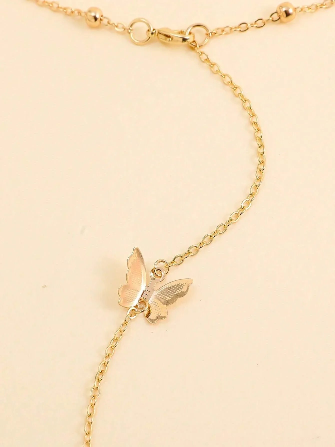 Buy Butterfly Charm Back Necklace in Pakistan