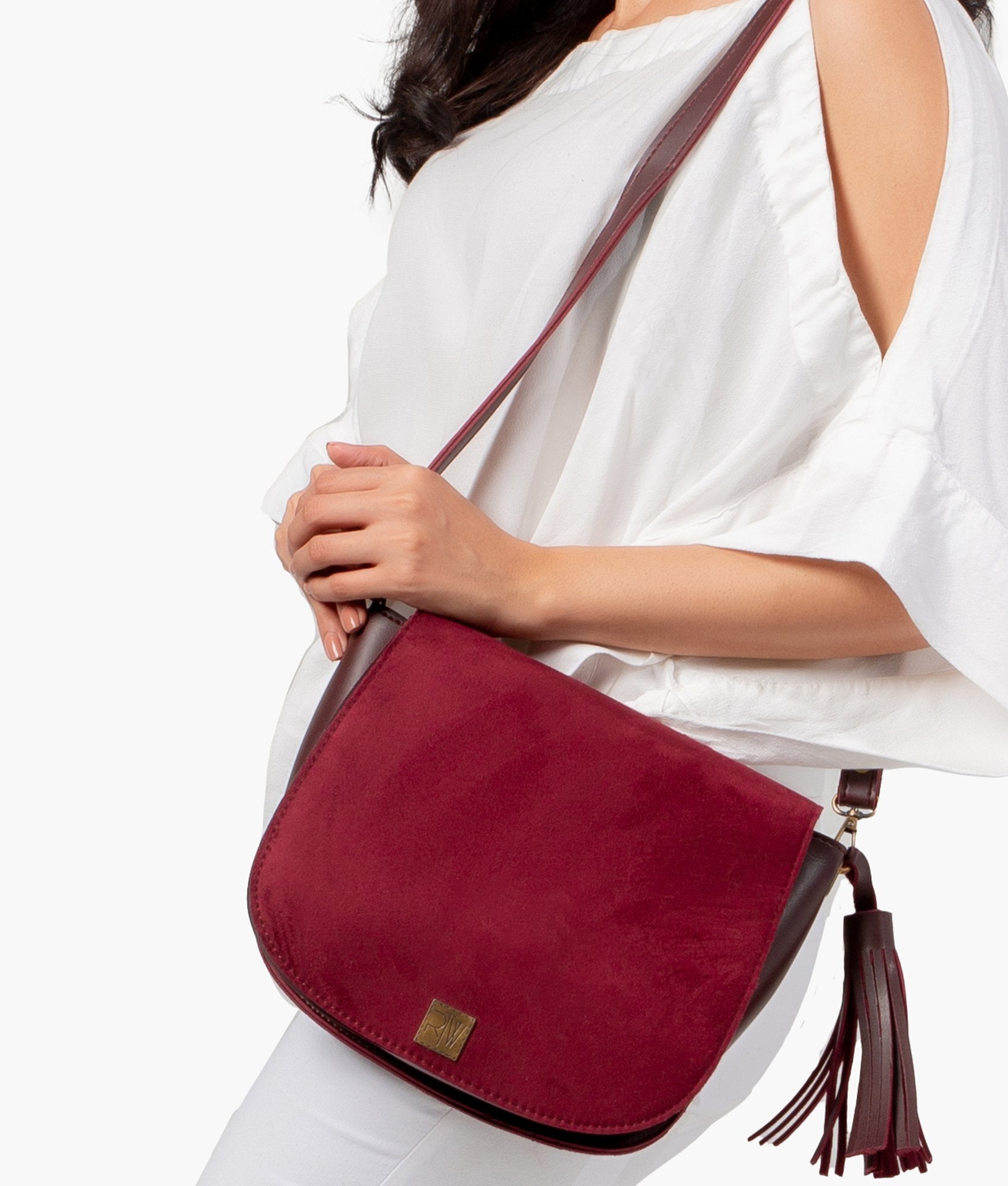 Buy Burgundy suede foldover saddle bag in Pakistan