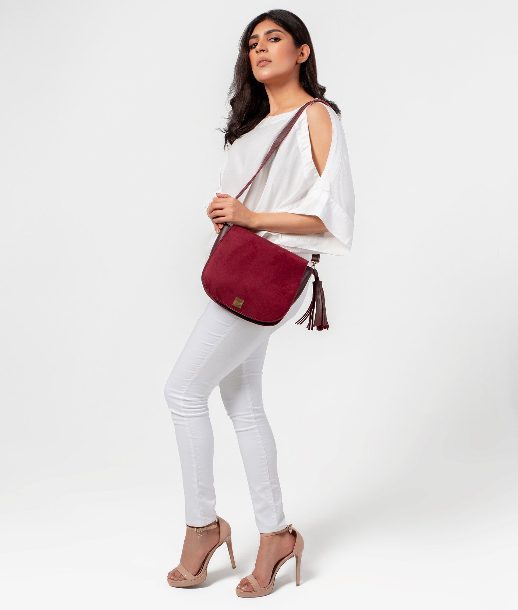 Buy Burgundy suede foldover saddle bag in Pakistan