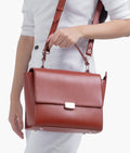 Buy Rust mini messenger bag in Pakistan