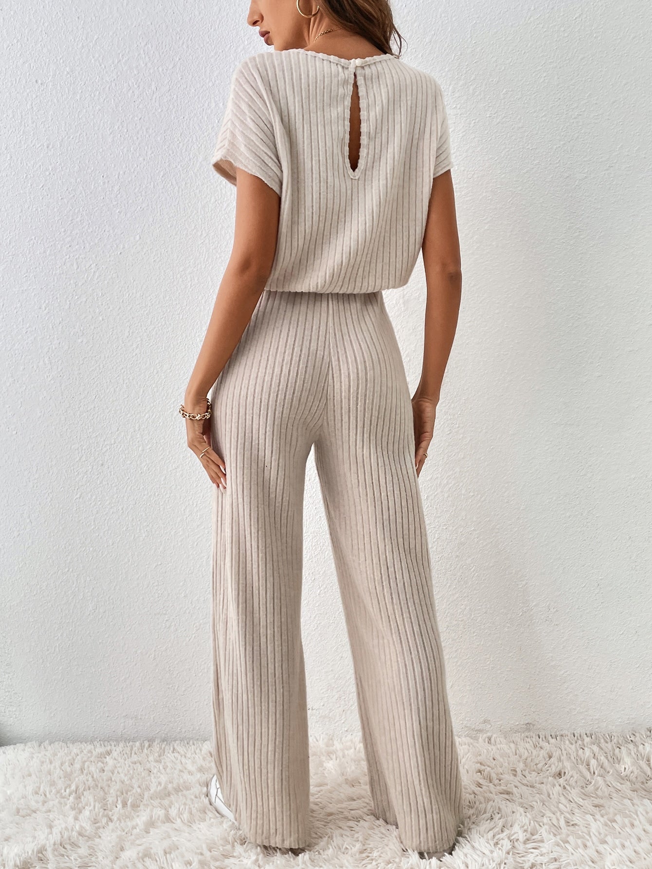 Buy SHEIN Essnce Solid Ribbed Knit Cut Out Back Jumpsuit in Pakistan