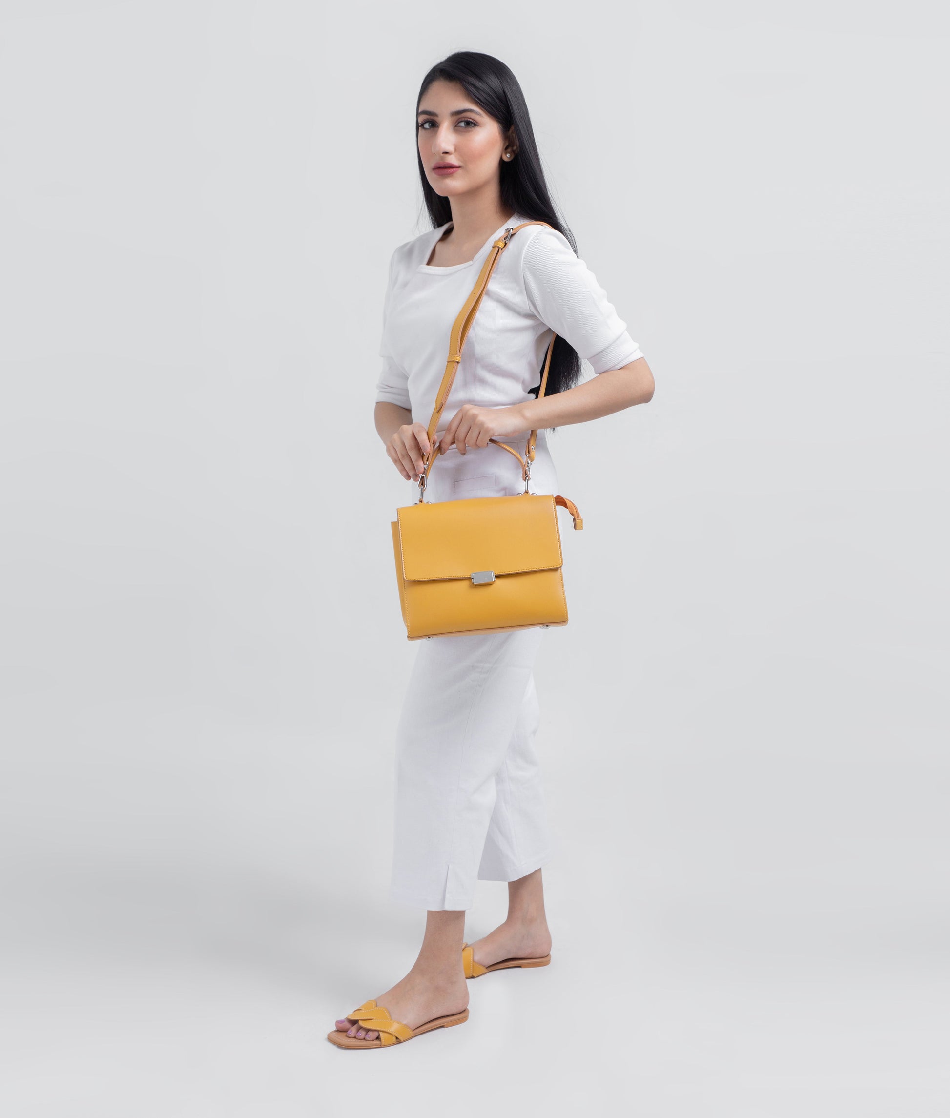 Buy Yellow mini messenger bag in Pakistan