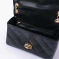 Buy Black quilted mini bag with chain in Pakistan