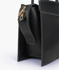 Buy Black trapeze top-handle bag in Pakistan