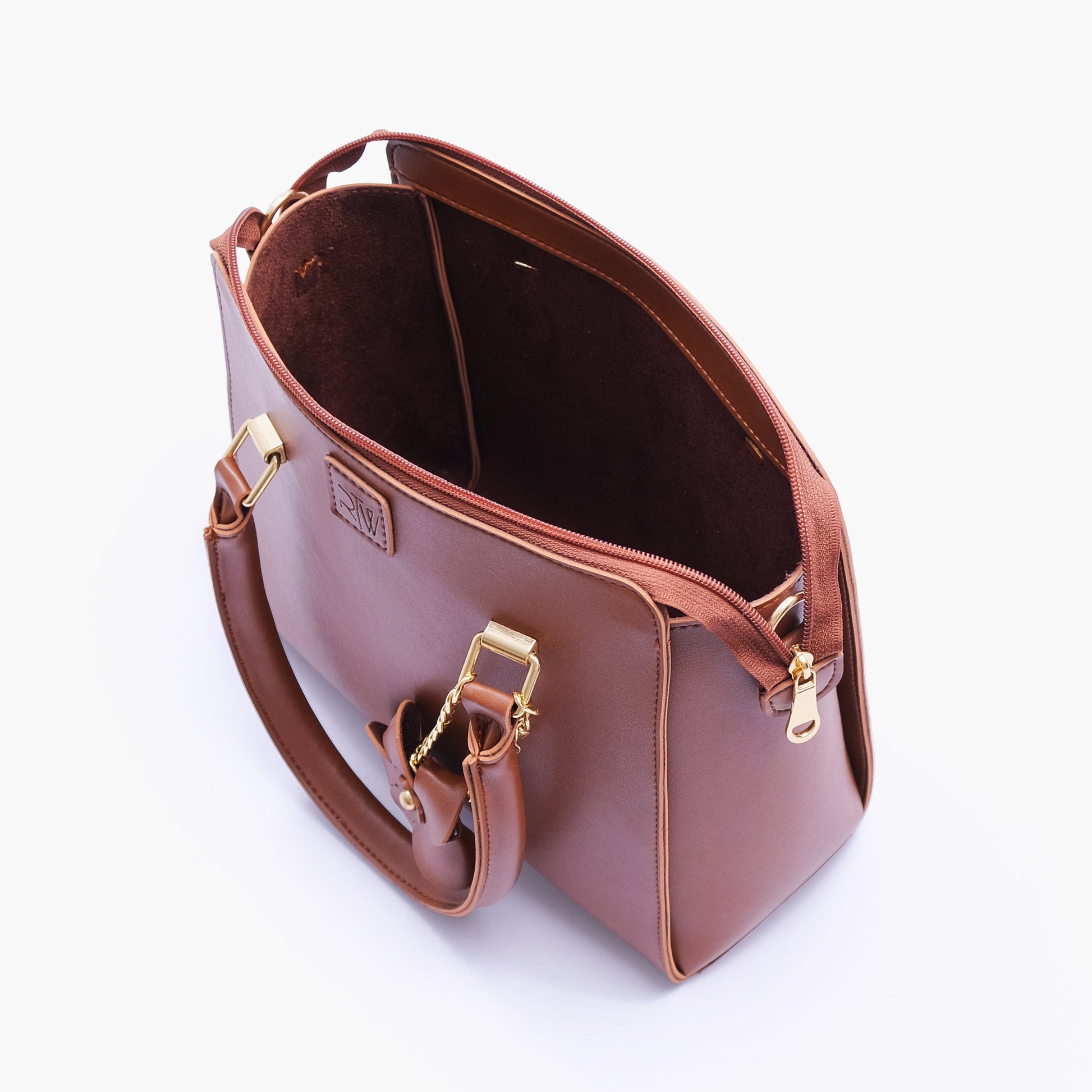 Buy Brown handbag with flower charm in Pakistan