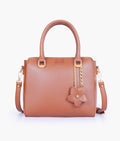 Buy Brown handbag with flower charm in Pakistan