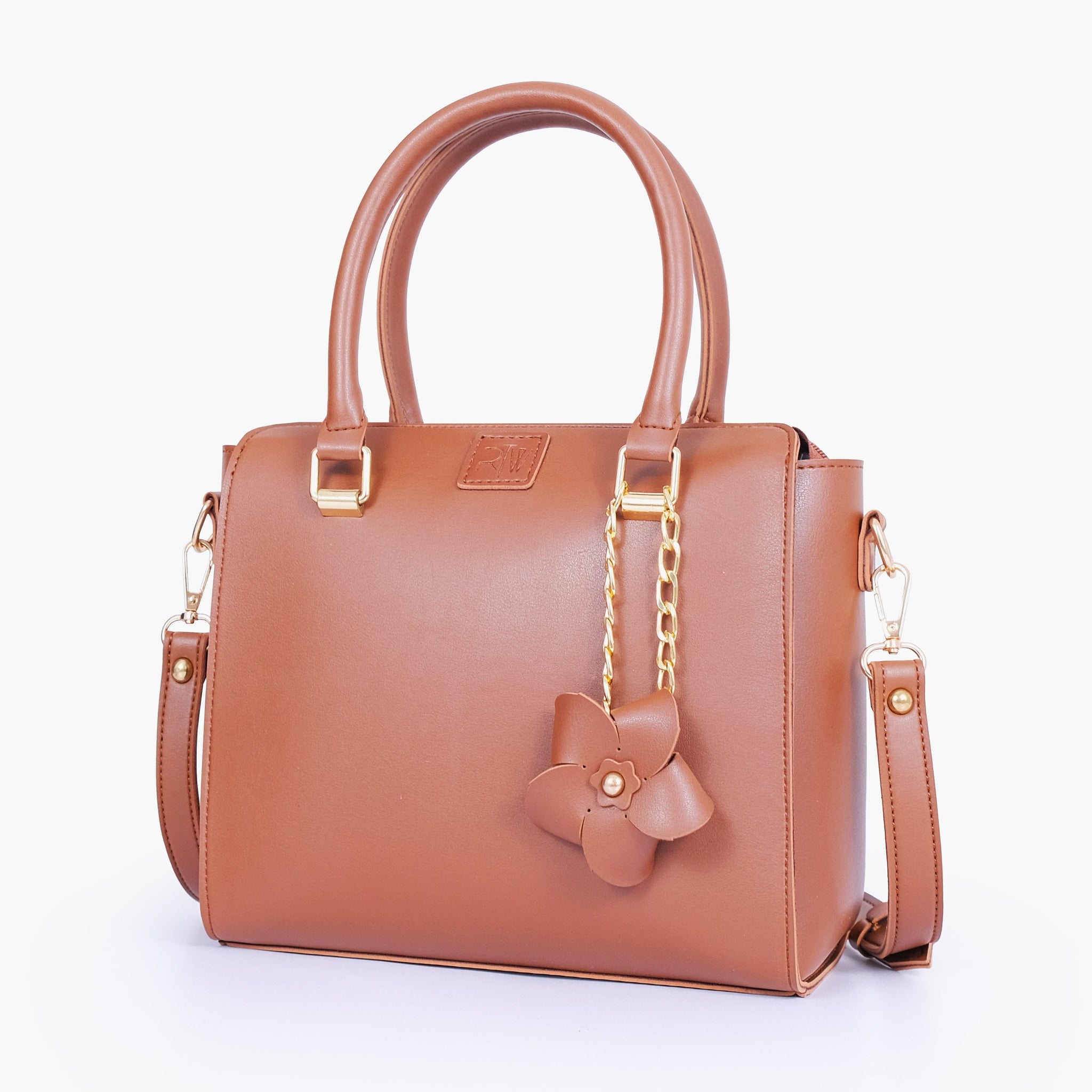 Buy Brown handbag with flower charm in Pakistan