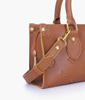 Buy Brown on-the-go mini bag in Pakistan