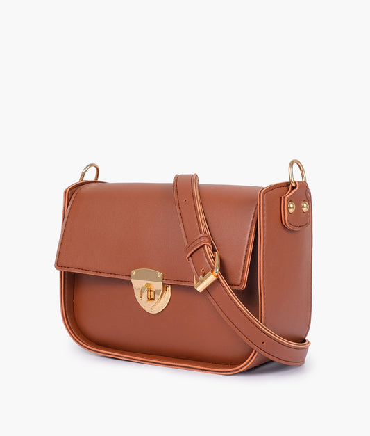 Buy Brown saddle bag with twist lock in Pakistan