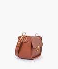 Buy Brown saddle bag with twist lock in Pakistan