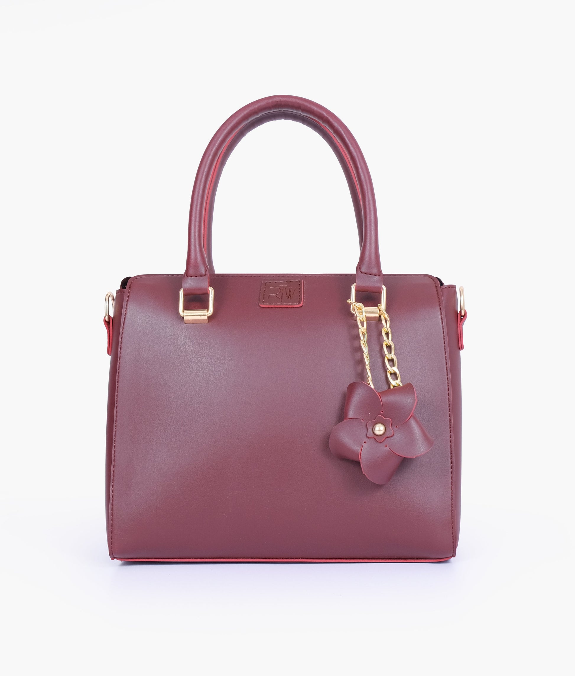 Buy Burgundy handbag with flower charm in Pakistan