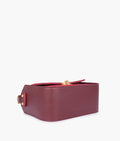 Buy Burgundy suede saddle bag with twist lock in Pakistan