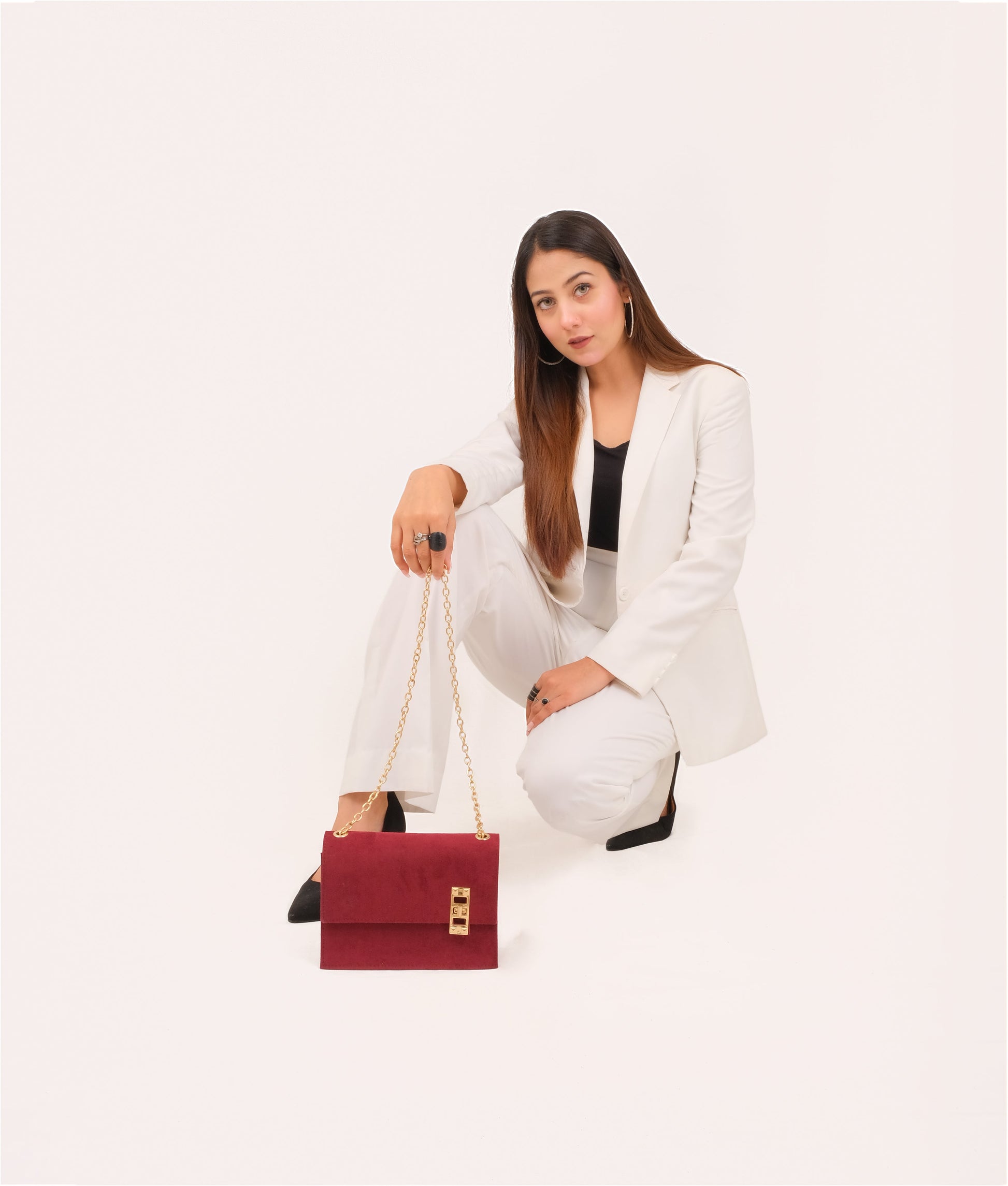 Buy Burgundy suede chain shoulder bag with twist lock in Pakistan