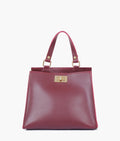 Buy Burgundy suede front lock top-handle mini bag in Pakistan