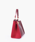 Buy Burgundy suede front lock top-handle mini bag in Pakistan