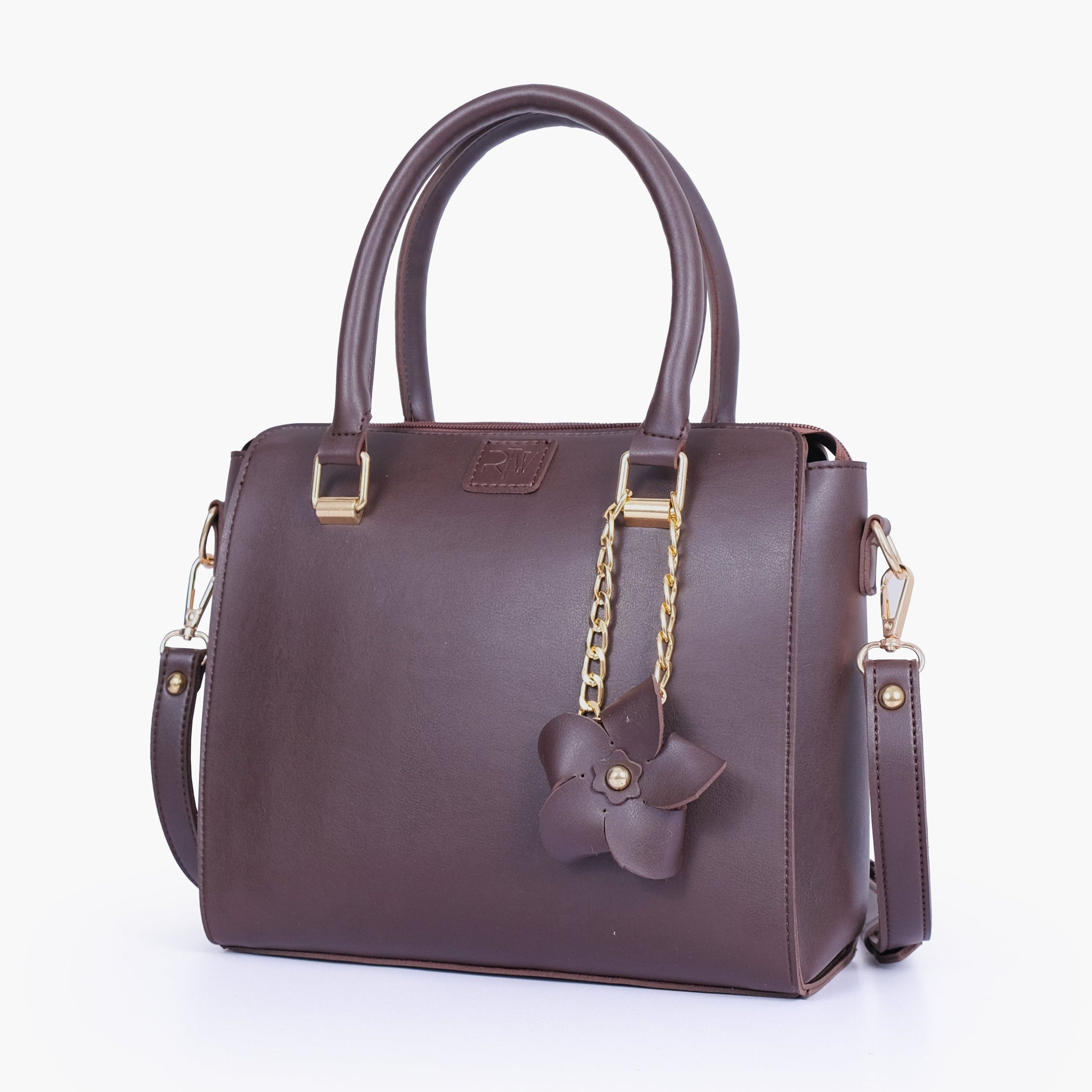 Buy Dark brown handbag with flower charm in Pakistan