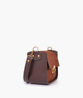 Buy Dark brown suede saddle bag with twist lock in Pakistan