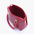 Buy Maroon handbag with flower charm in Pakistan