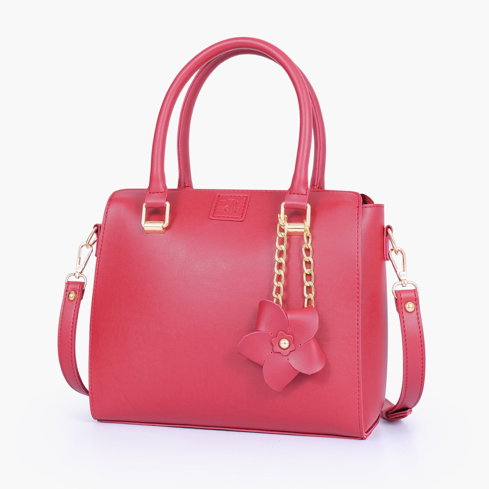 Buy Maroon handbag with flower charm in Pakistan