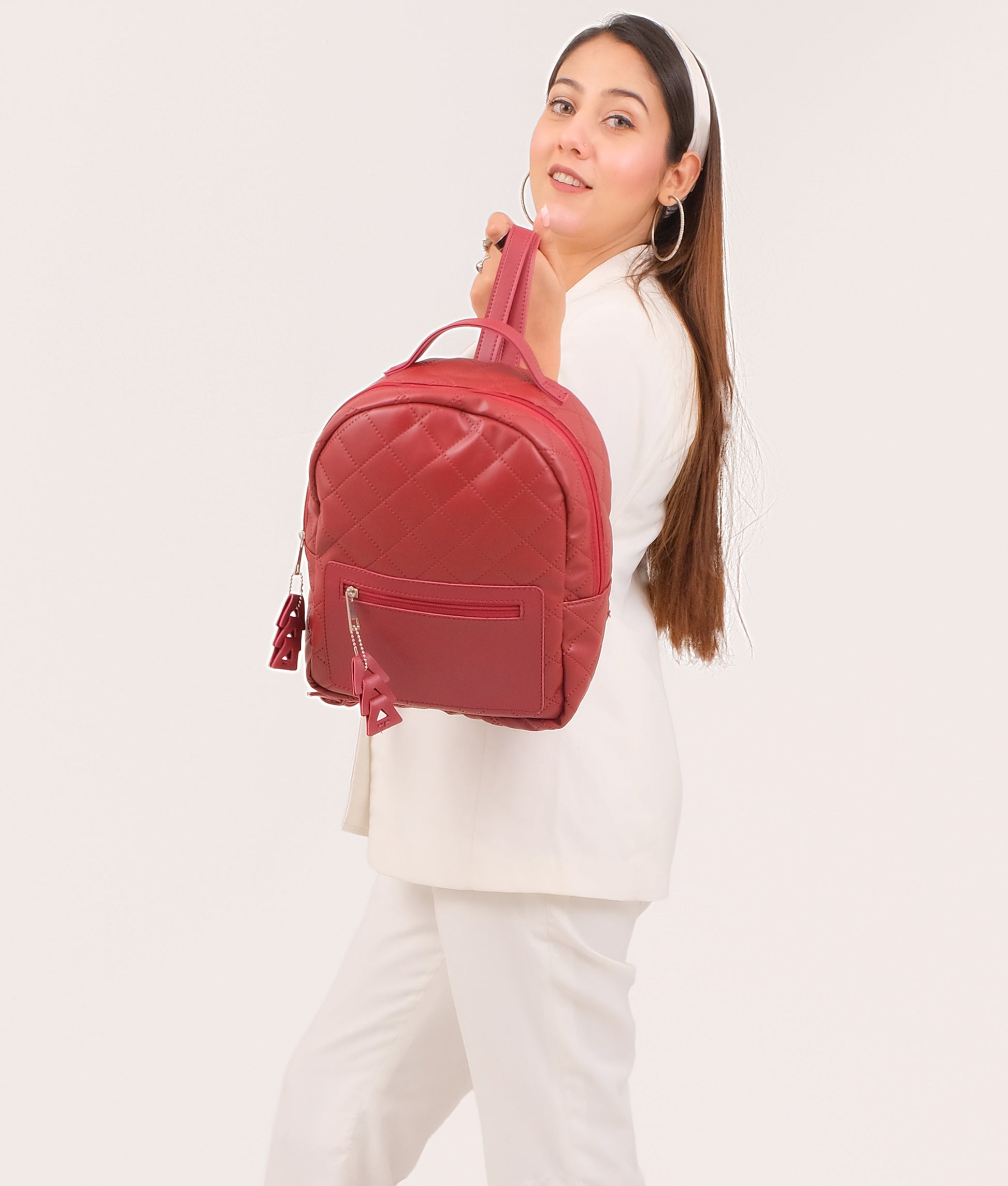 Buy Maroon quilted mini backpack in Pakistan