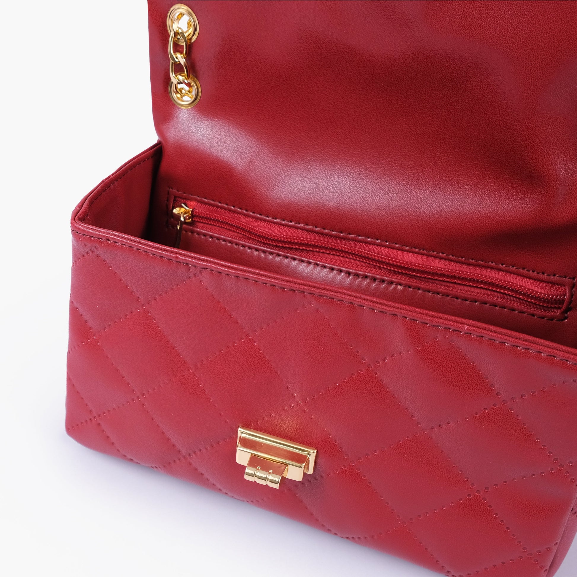 Buy Maroon quilted mini bag with chain in Pakistan