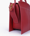 Buy Maroon trapeze top-handle bag in Pakistan