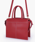 Buy Maroon trapeze top-handle bag in Pakistan