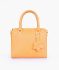 Buy Mustard handbag with flower charm in Pakistan