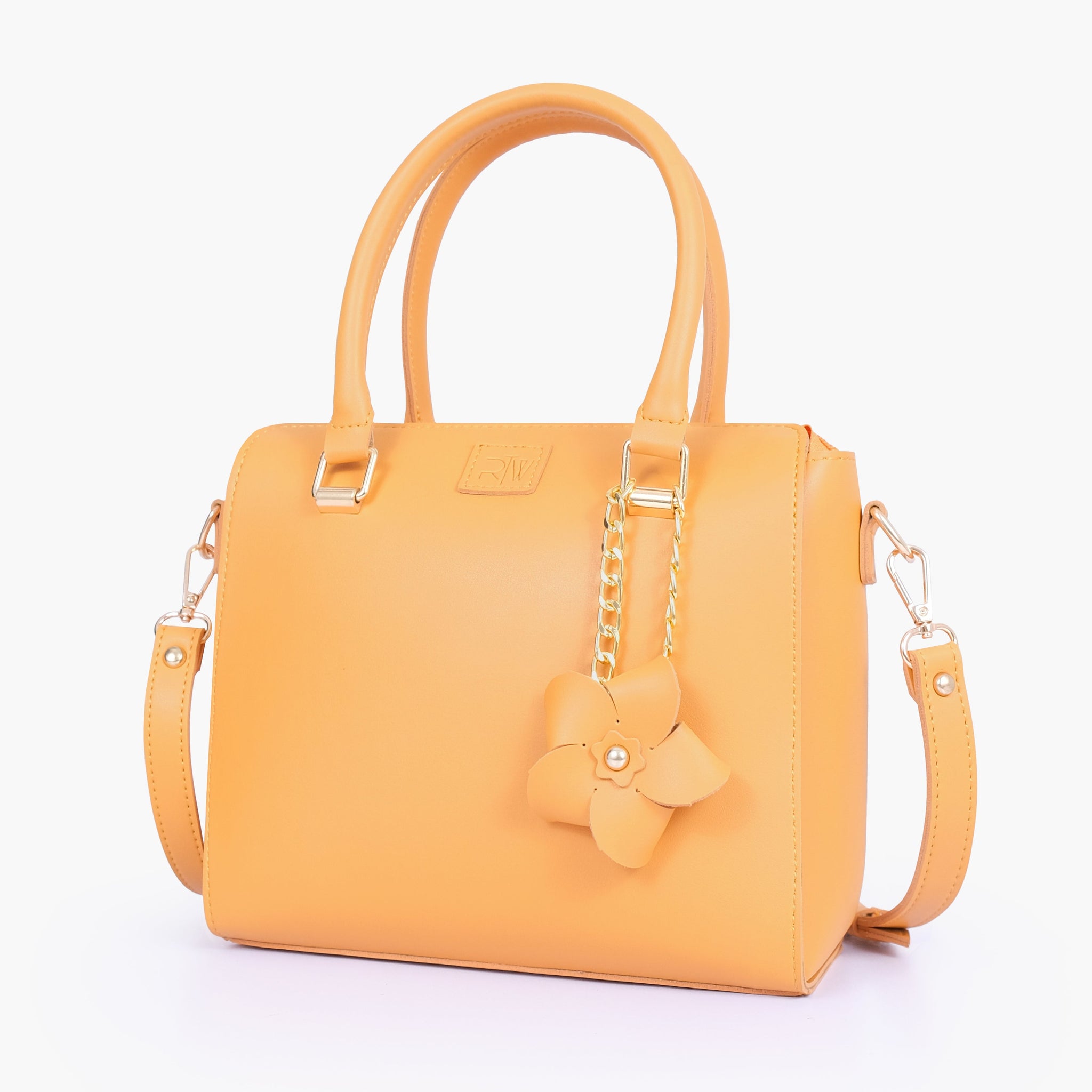 Buy Mustard handbag with flower charm in Pakistan