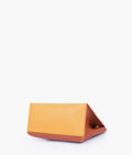 Buy Mustard front lock top-handle mini bag in Pakistan