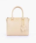 Buy Off-white handbag with flower charm in Pakistan