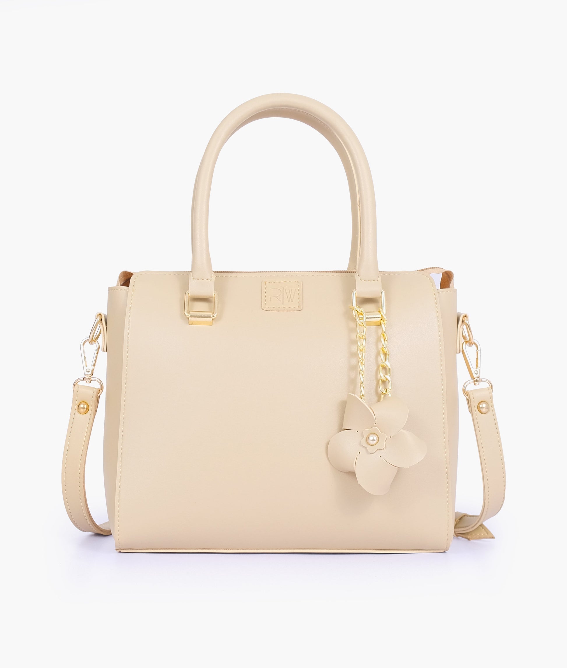 Buy Off-white handbag with flower charm in Pakistan