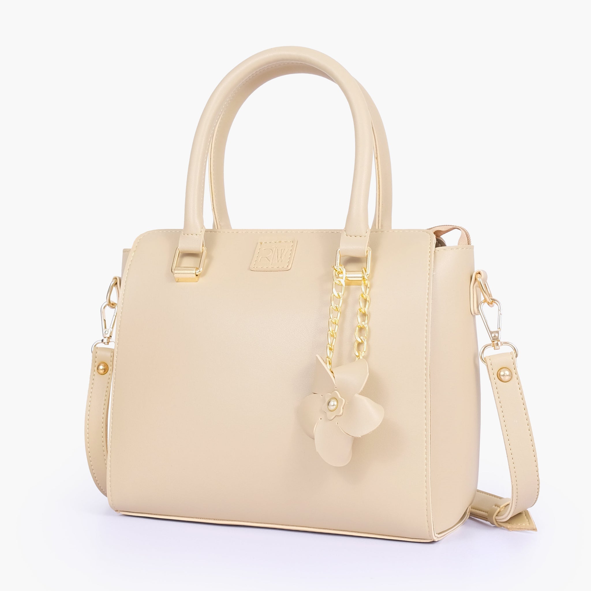 Buy Off-white handbag with flower charm in Pakistan