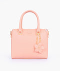 Buy Peach handbag with flower charm in Pakistan