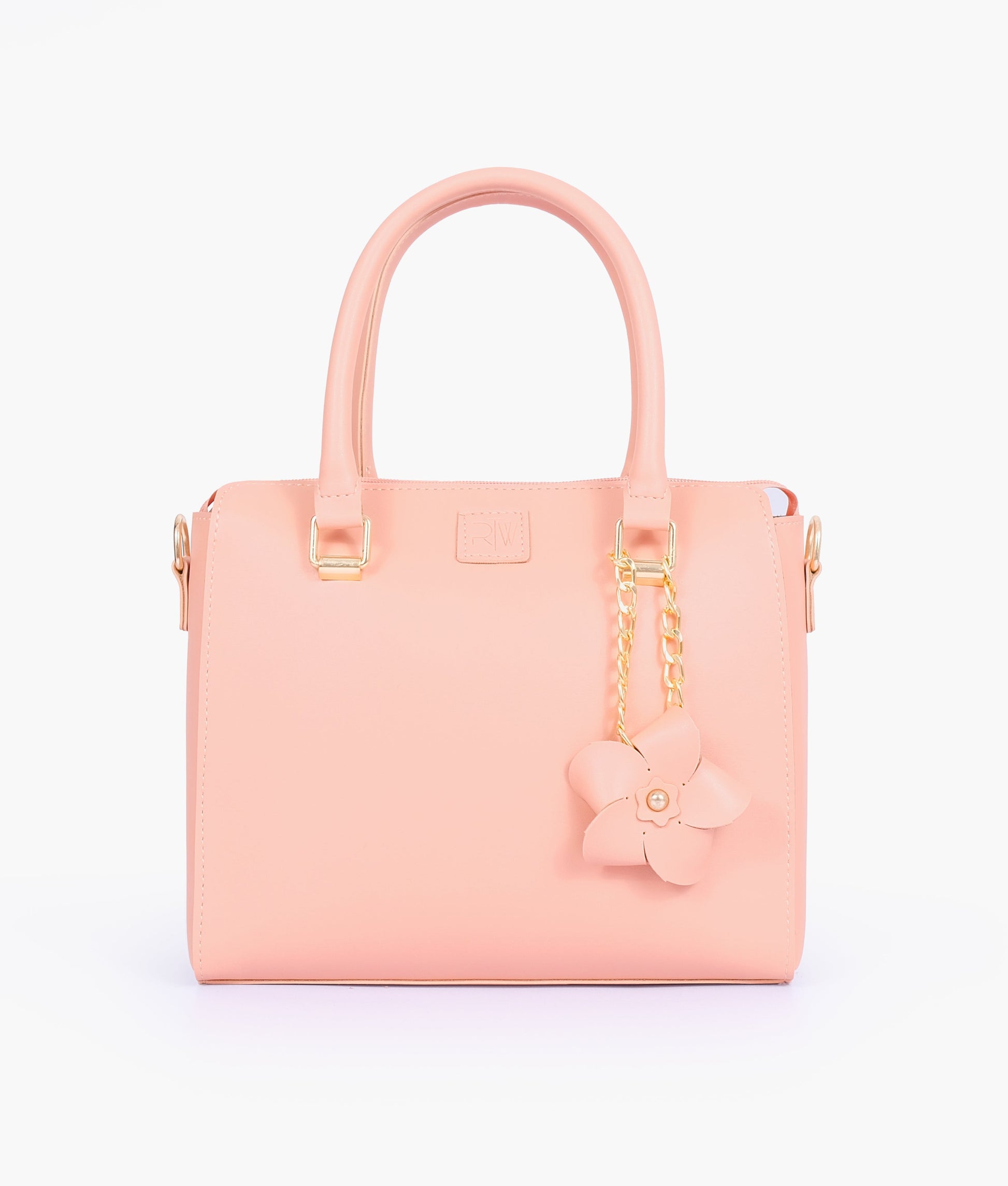 Buy Peach handbag with flower charm in Pakistan