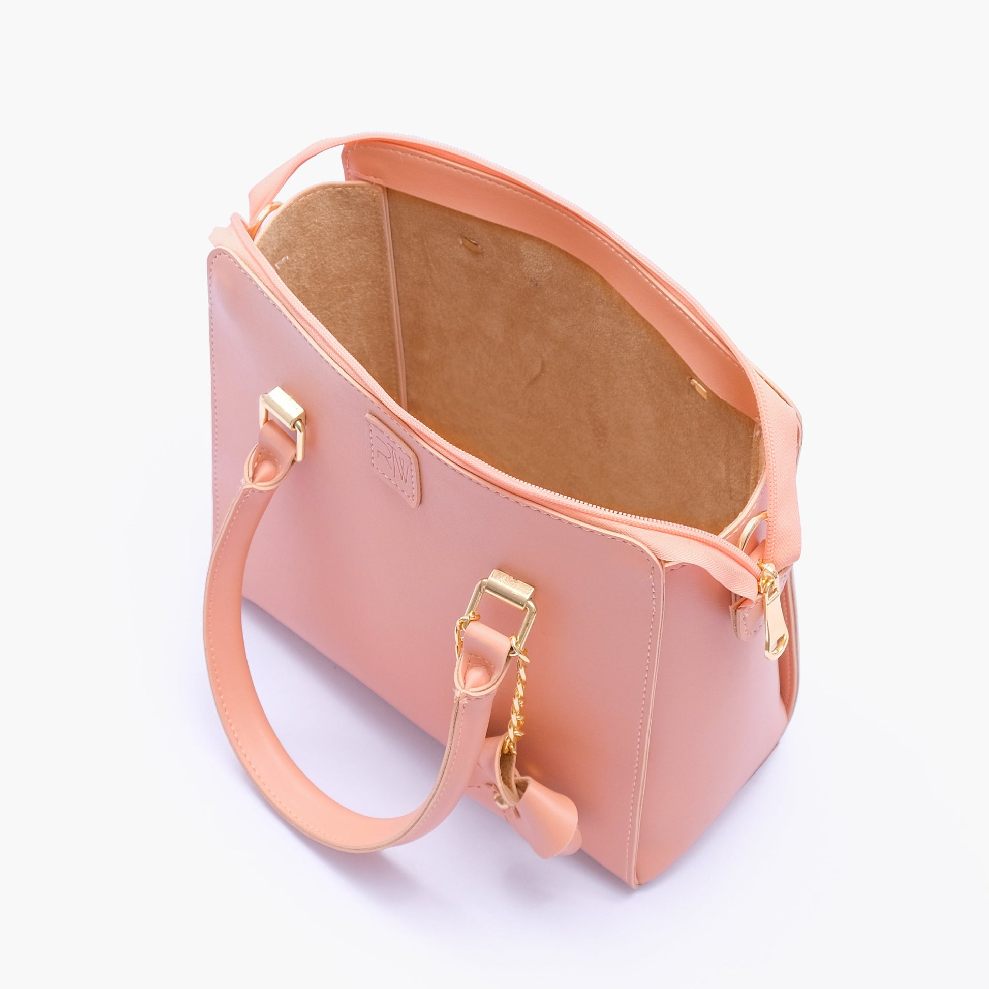 Buy Peach handbag with flower charm in Pakistan