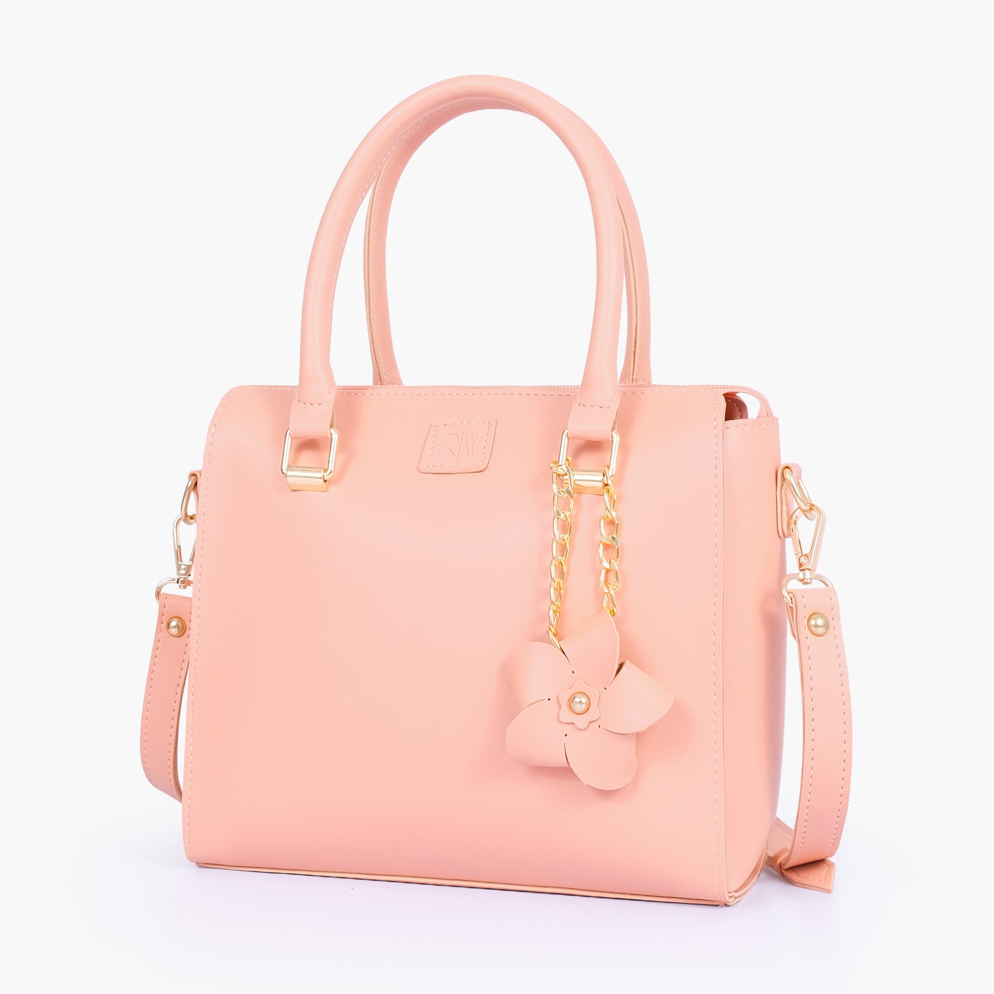 Buy Peach handbag with flower charm in Pakistan