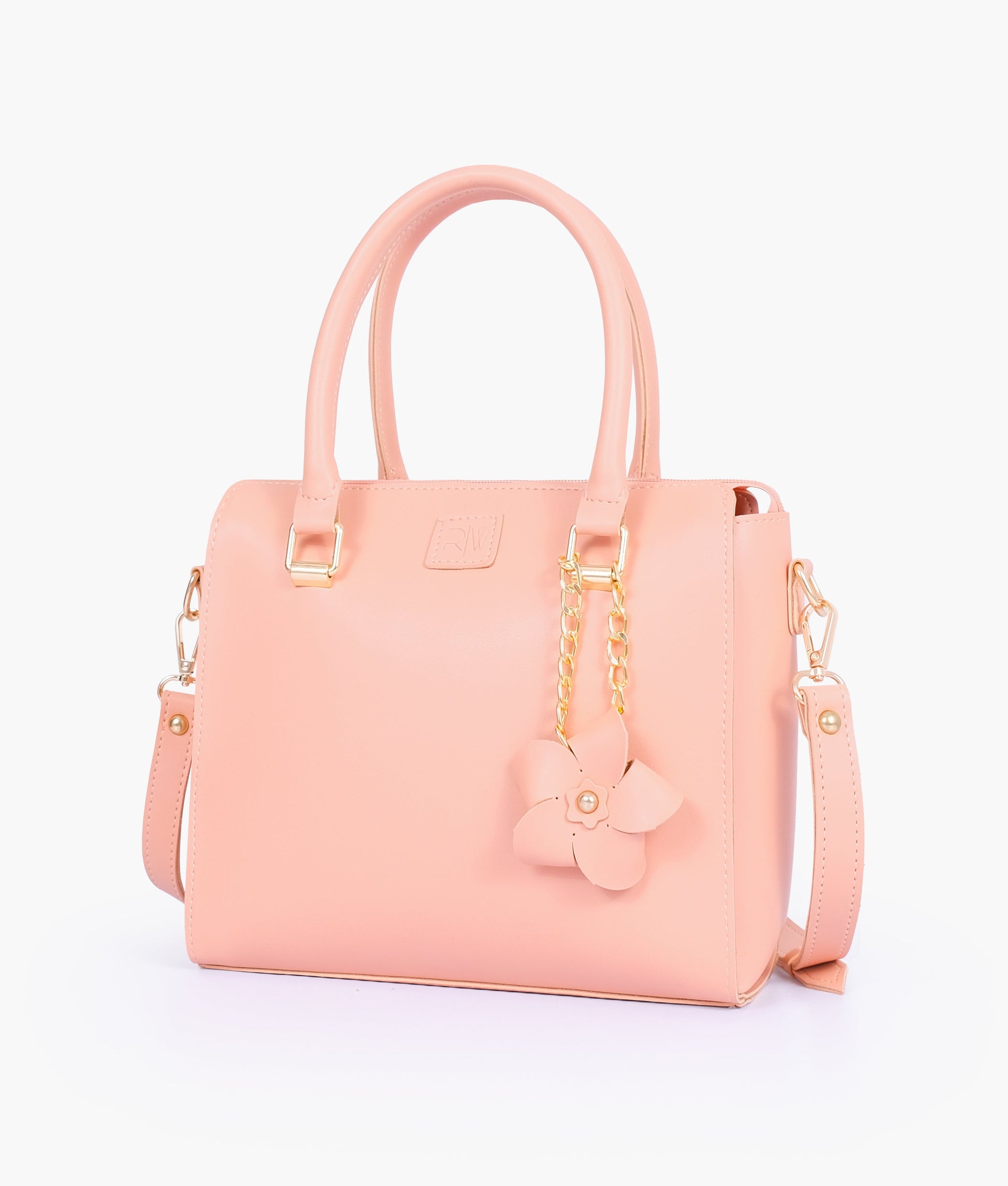 Buy Peach handbag with flower charm in Pakistan