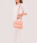 Buy Peach mini top-handle bag in Pakistan