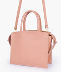 Buy Peach trapeze top-handle bag in Pakistan