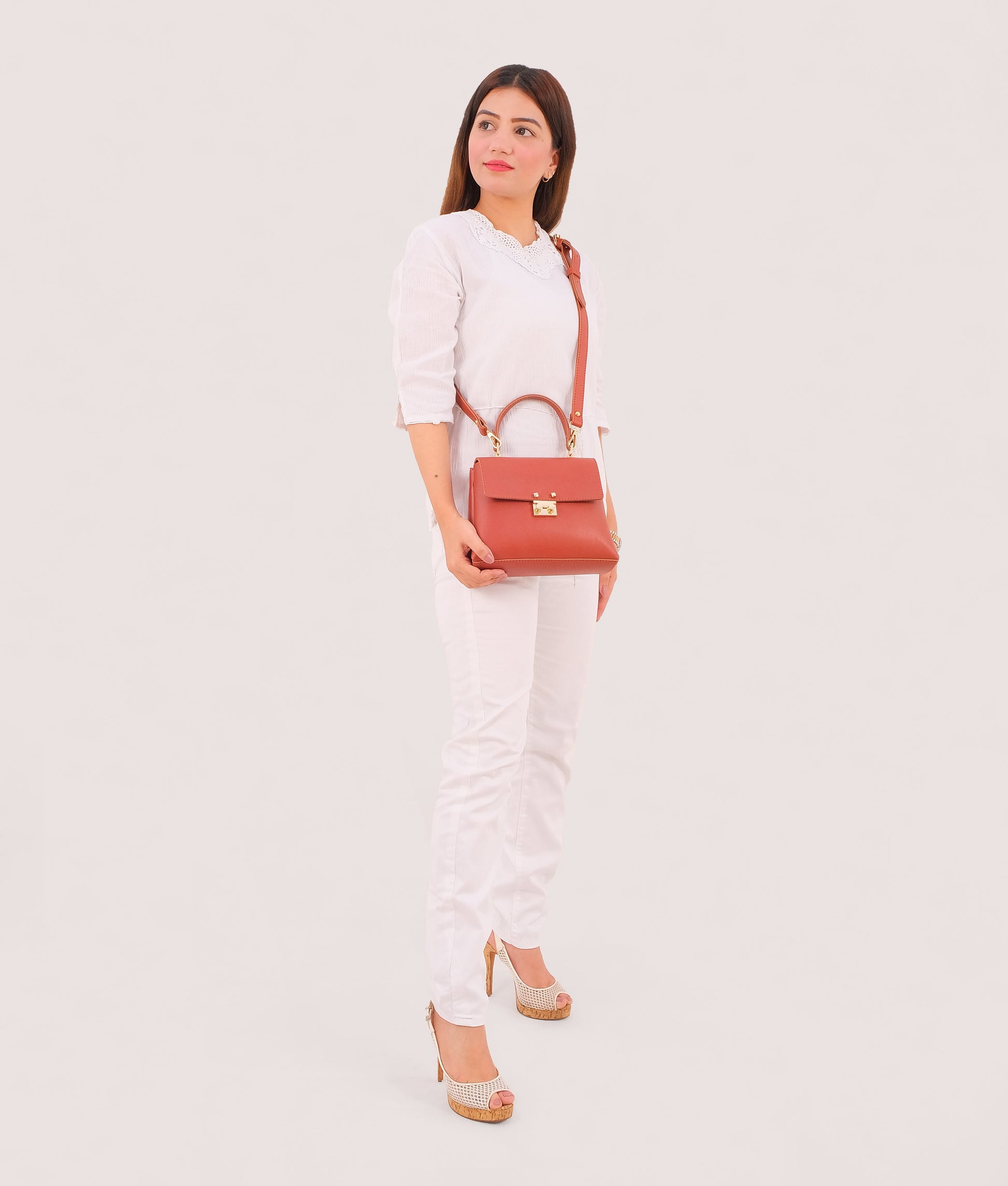 Buy Rust mini top-handle bag in Pakistan