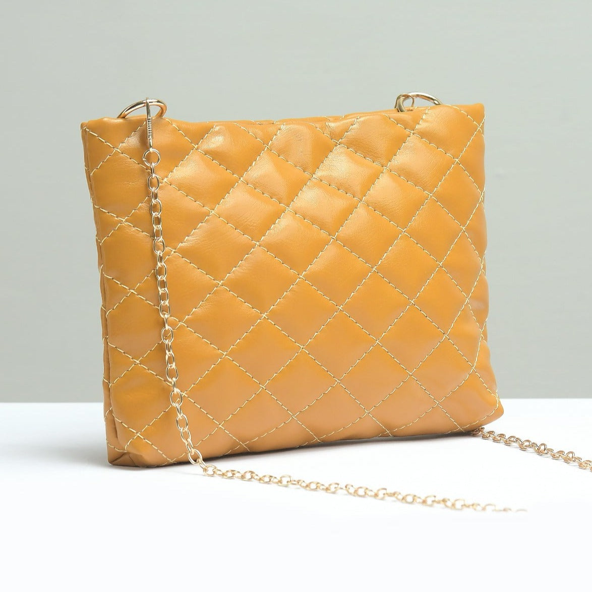 Buy Negative Apparel Small Quilted Embossed Pouch FD - Mustard in Pakistan